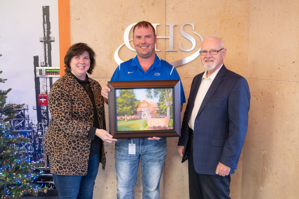 CHS receives printed painting of CCCK campus in recognition of Business of the Quarter award