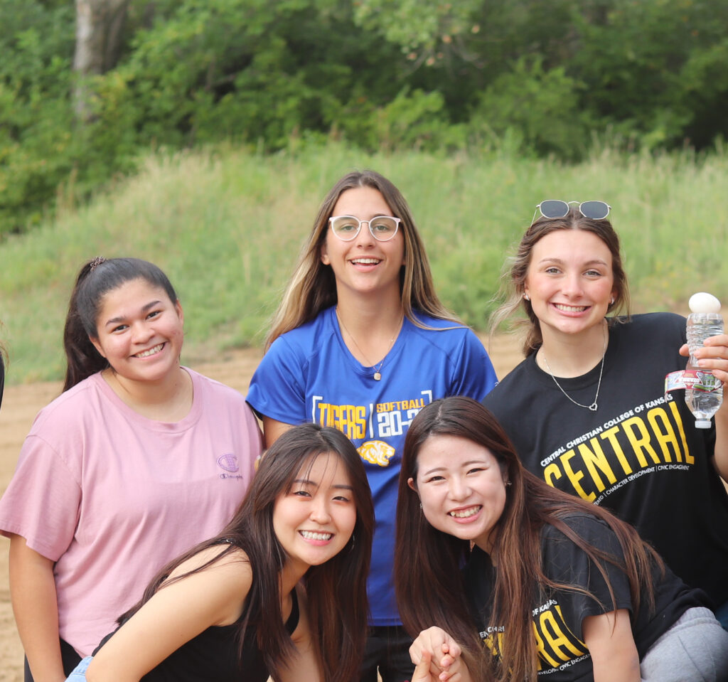 Group of students smiling at the all school picnic