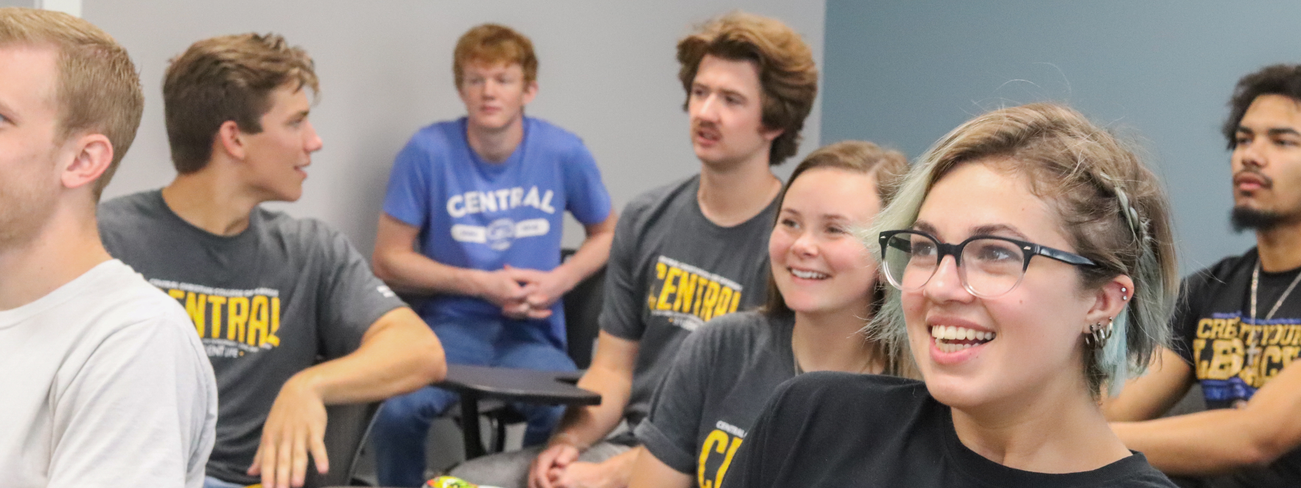 Mathematics Photo Header: Central students sitting in a classroom smiling and talking to each other