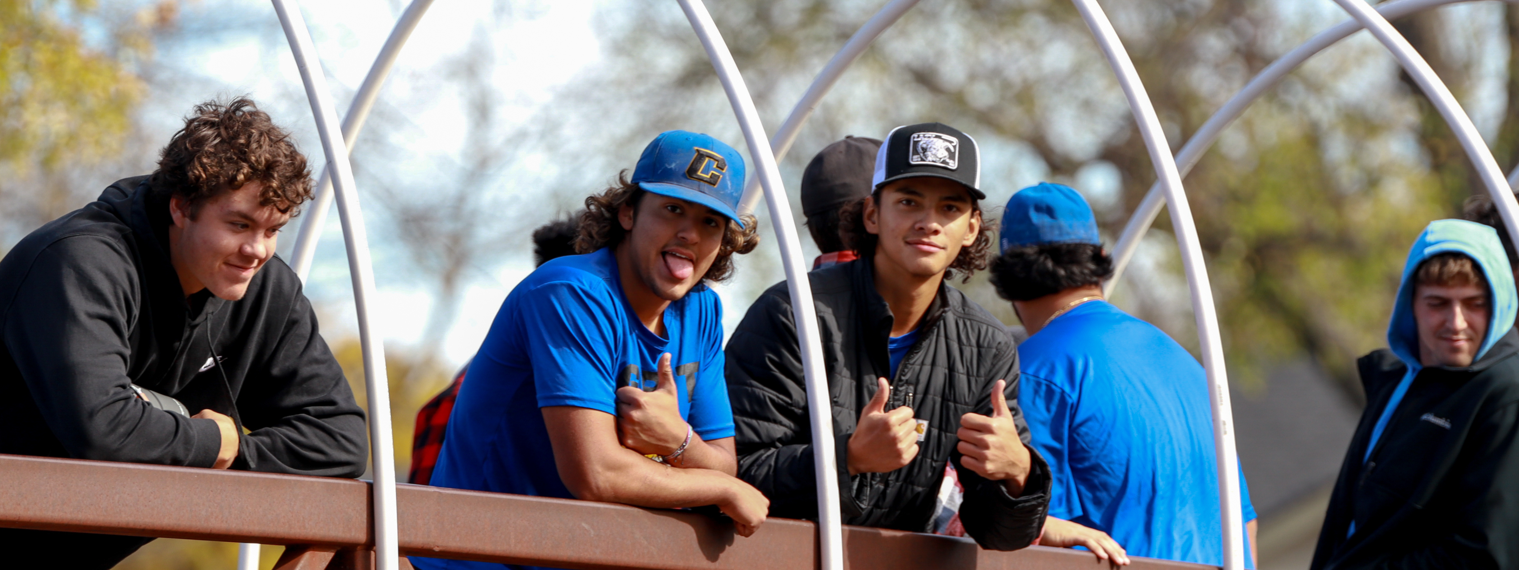 Fitness & Recreational Leadership Photo Header: Baseball players standing on bridge and posing for camera