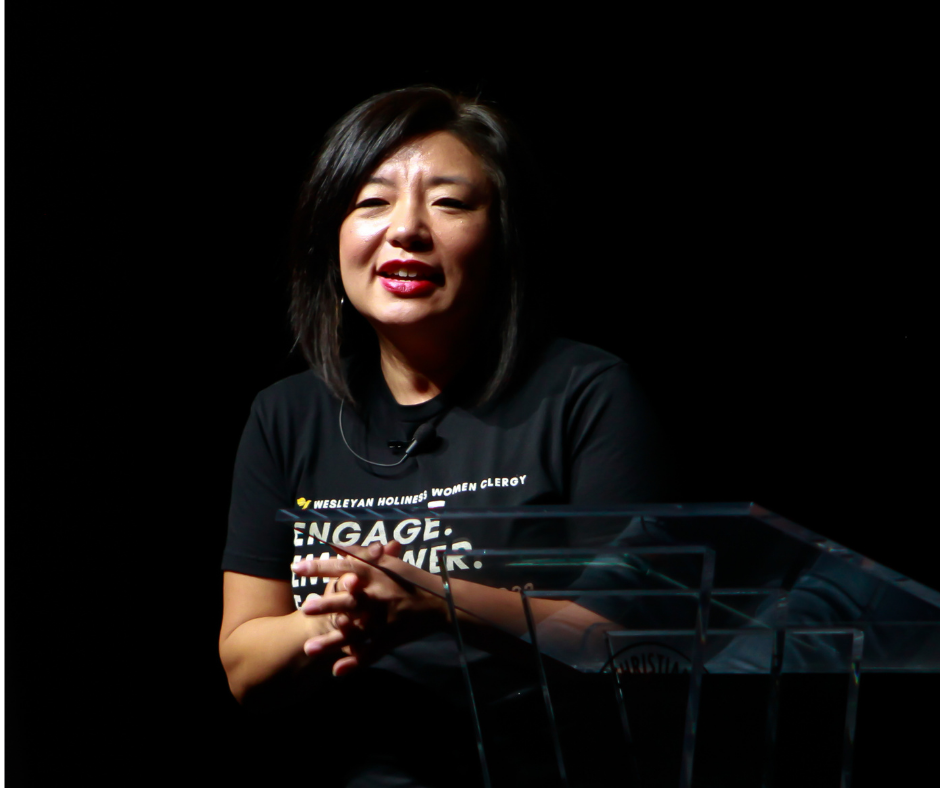 Soo Ji Alverez, an asian woman, speaking in chapel in Greer Auditorium
