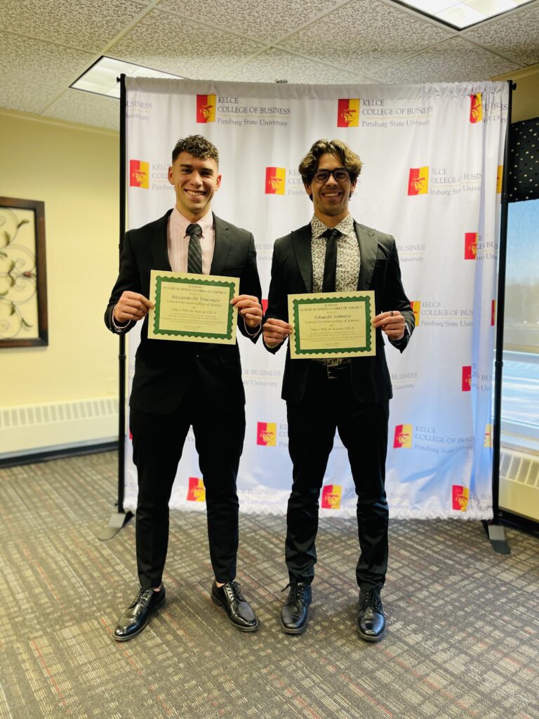 Two students pose with their awards.