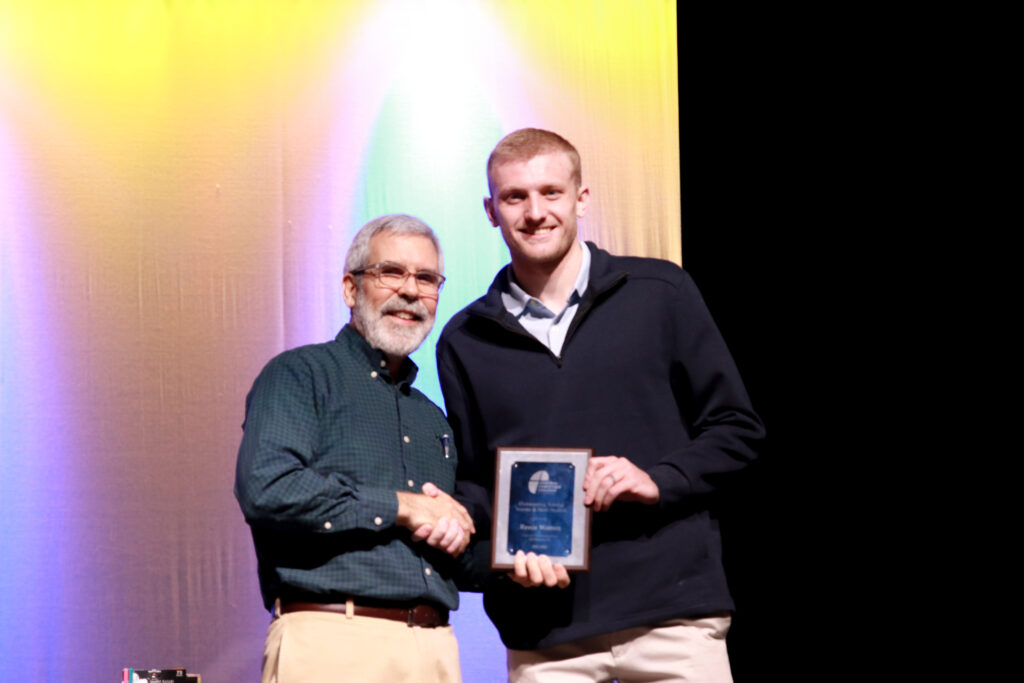 Mike Craig awards Reece Warren the Outstanding Science and Math Student Award